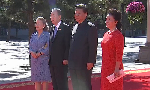 Chinese President Xi Jinping and his wife PengLiyuan greet UN Secretary-General Ban Ki-moon and his wife ahead of the V-Day parade on Sept. 3, 2015.