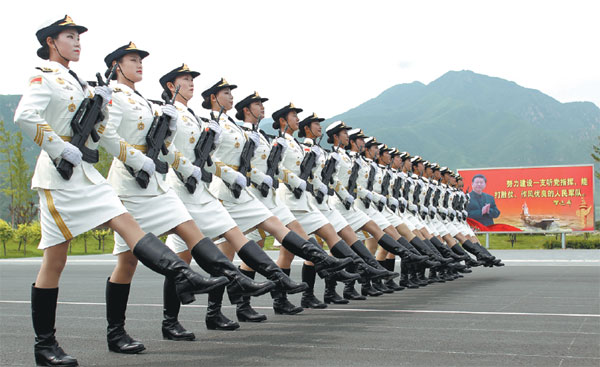 Female honor guards train at a camp in Beijing ahead of the military parade in the capital on Sept 3. 