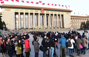 Journalists wait to enter the Great Hall of the People before the fourth session of China's 12th National People's Congress (NPC) in Beijing, capital of China, March 5, 2016. 