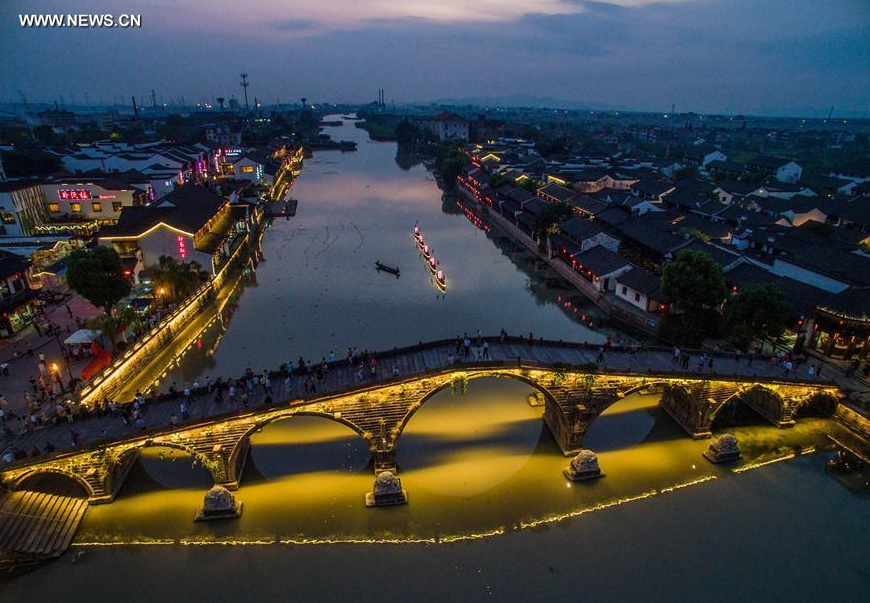 Photo taken with a mobile phone shows the musical fountain in front of the Hangzhou Grand Theatre in Hangzhou, capital of east China's Zhejiang Province, Aug. 27, 2016. 