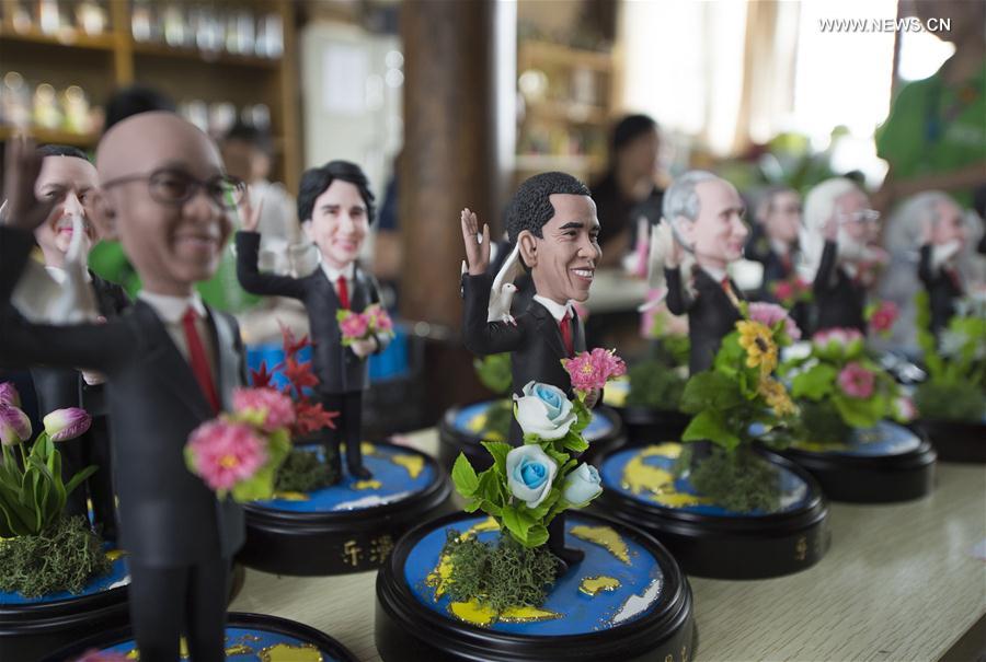 Clay figures featuring the leaders to attend the upcoming G20 Summit are seen in Hangzhou, capital of east China's Zhejiang Province, Sept. 1, 2016. Made by artist Wu Xiaoli with the name "Dream of World Peace", the clay figures were displayed at Hangzhou's Qiaoxi historic block. 